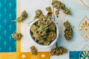 A top view of weed buds in a cup on the table
